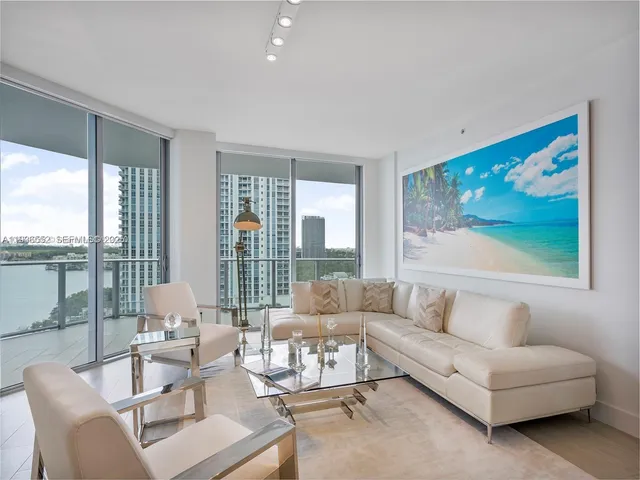 a living room with furniture and a table