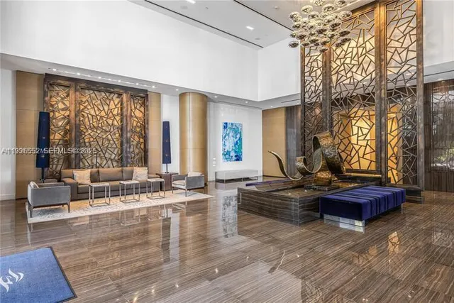 a view of a living room and kitchen