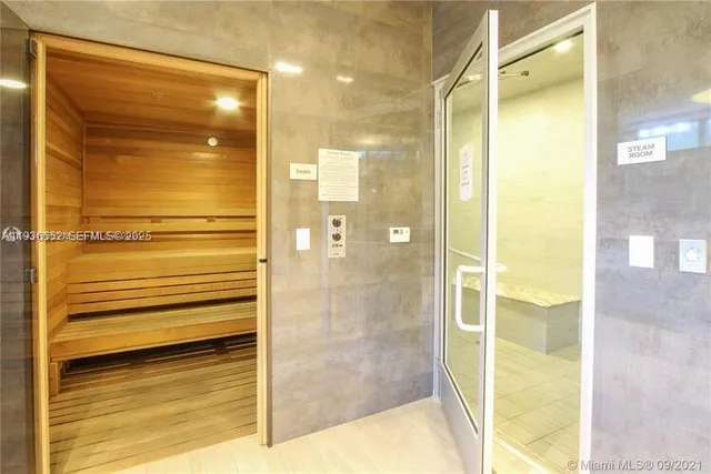 a bathroom with a bathtub and shower