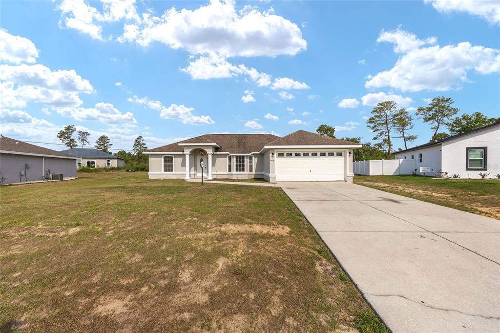 15434 Southwest 23rd Court Road Ocala, FL 34473 - Photo 2 of 41 a view of house and outdoor space