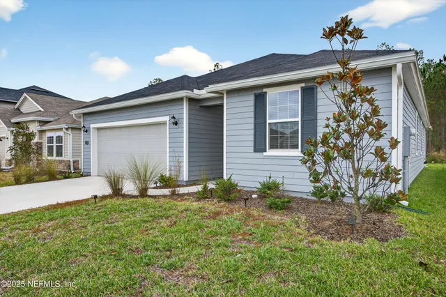 front view of a house with a yard