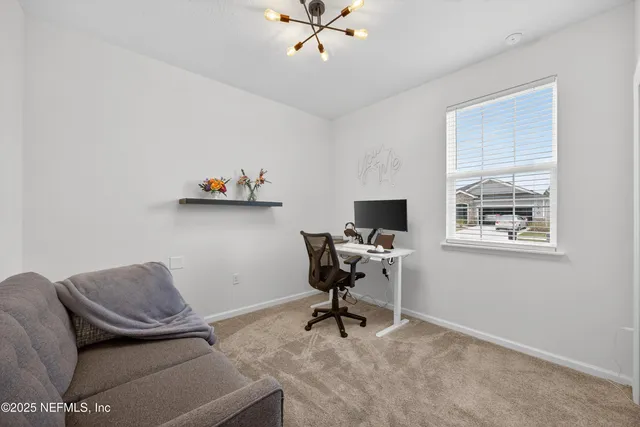 a workspace with furniture and window