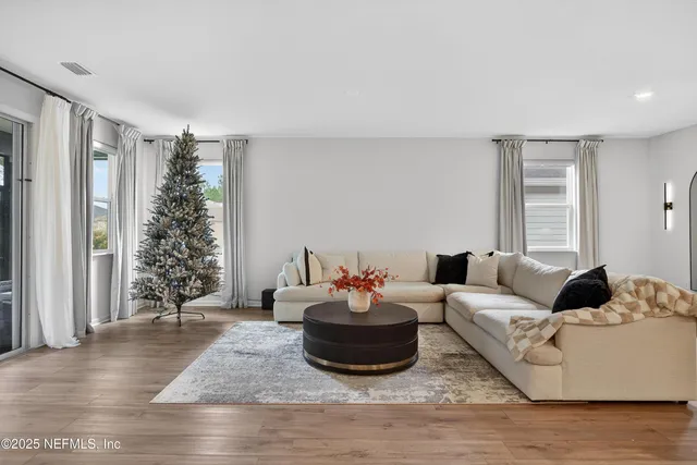 a living room with furniture and window