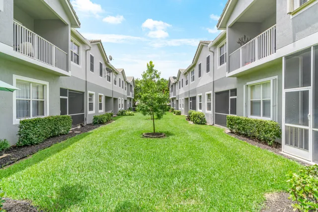 a view of an apartment with a garden and plants
