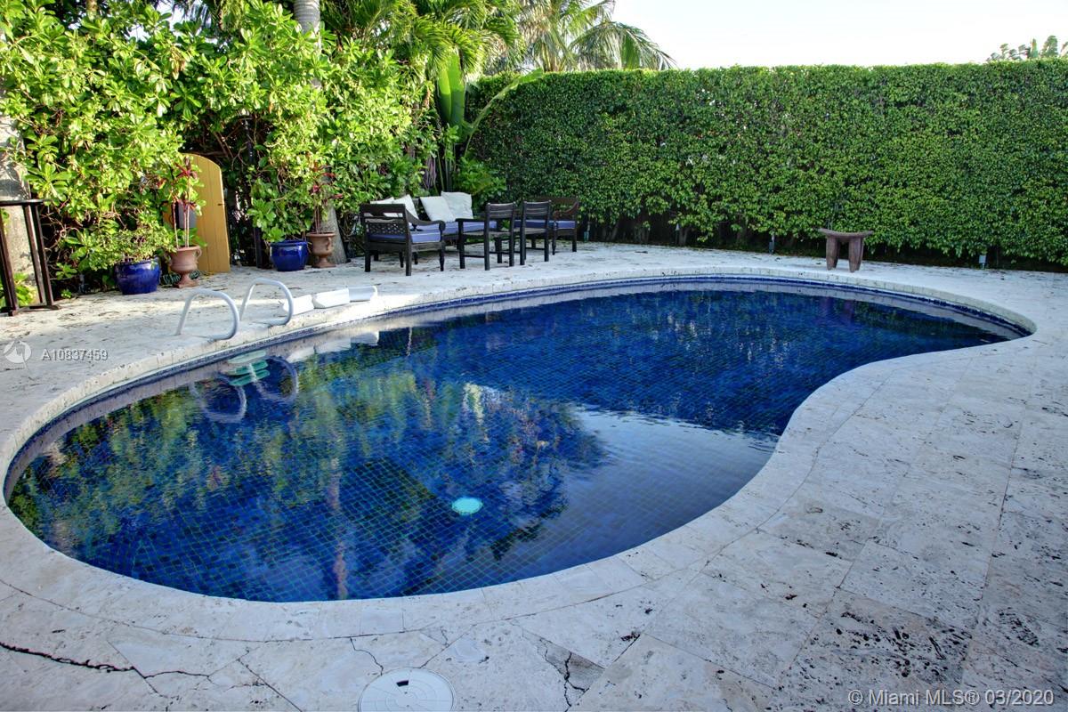 7975 Biscayne Point Circle Miami Beach, FL 33141 - Photo 11 of 34 a view of a swimming pool with a sitting area