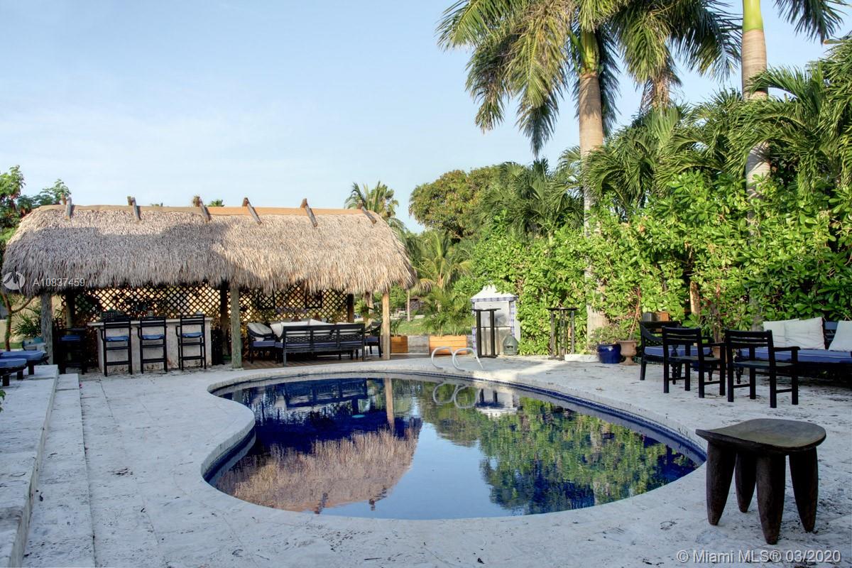 7975 Biscayne Point Circle Miami Beach, FL 33141 - Photo 14 of 34 a view of a house with outdoor seating area
