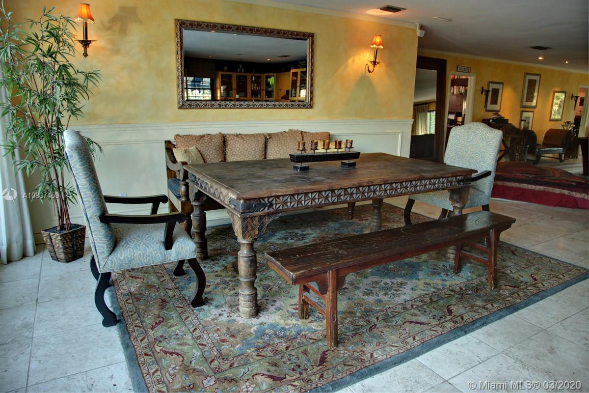 7975 Biscayne Point Circle Miami Beach, FL 33141 - Photo 16 of 34 a dining room with furniture and wooden floor
