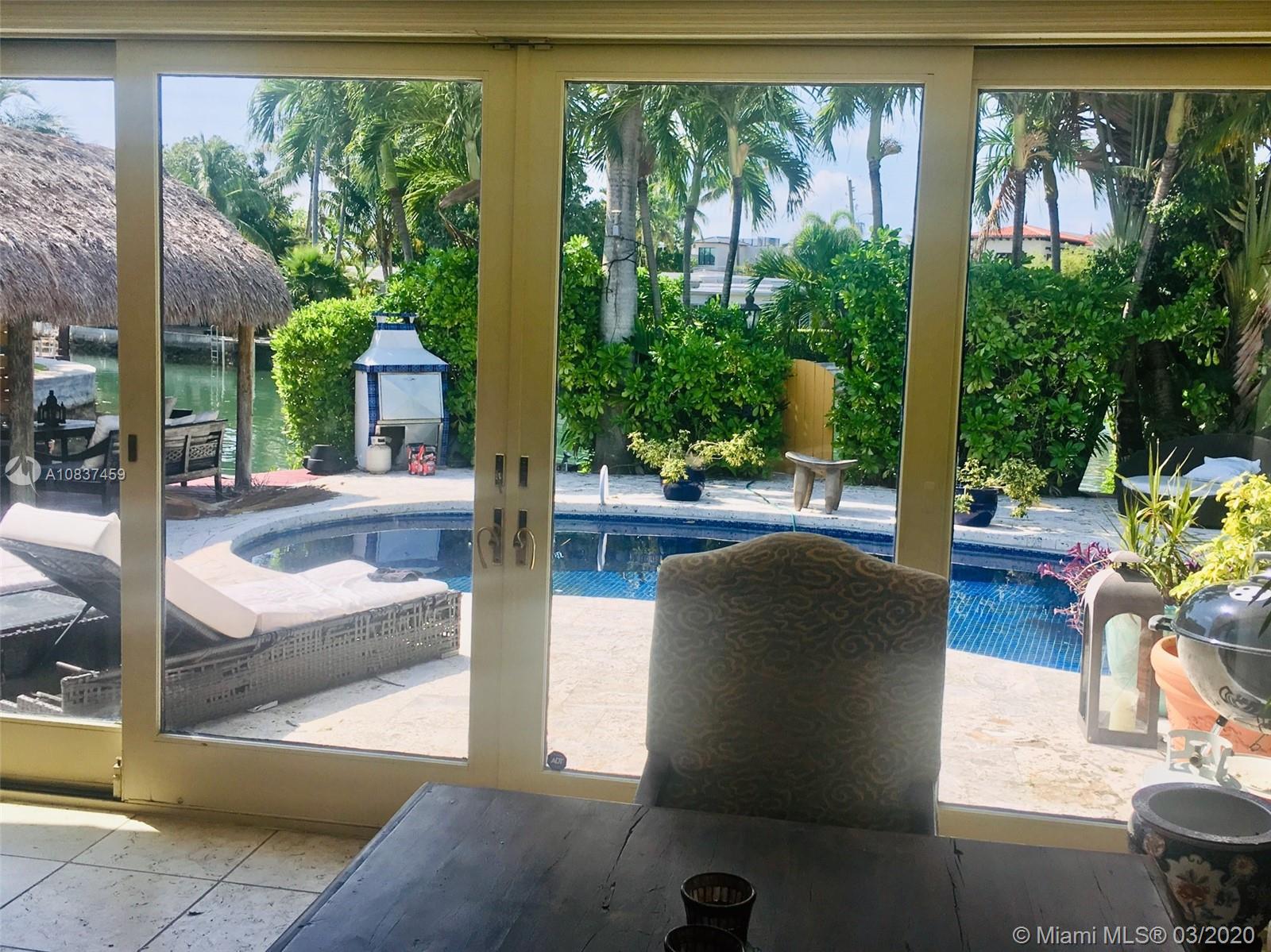 7975 Biscayne Point Circle Miami Beach, FL 33141 - Photo 18 of 34 a view of living room with furniture and garden view