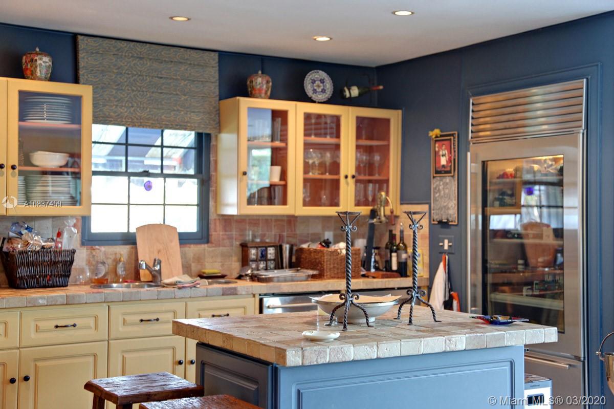 7975 Biscayne Point Circle Miami Beach, FL 33141 - Photo 20 of 34 a kitchen with a sink cabinets and window
