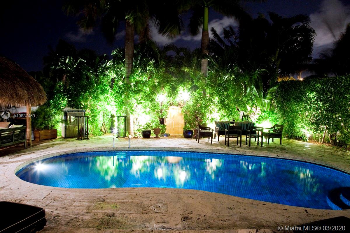 7975 Biscayne Point Circle Miami Beach, FL 33141 - Photo 29 of 34 a view of a swimming pool with an outdoor seating