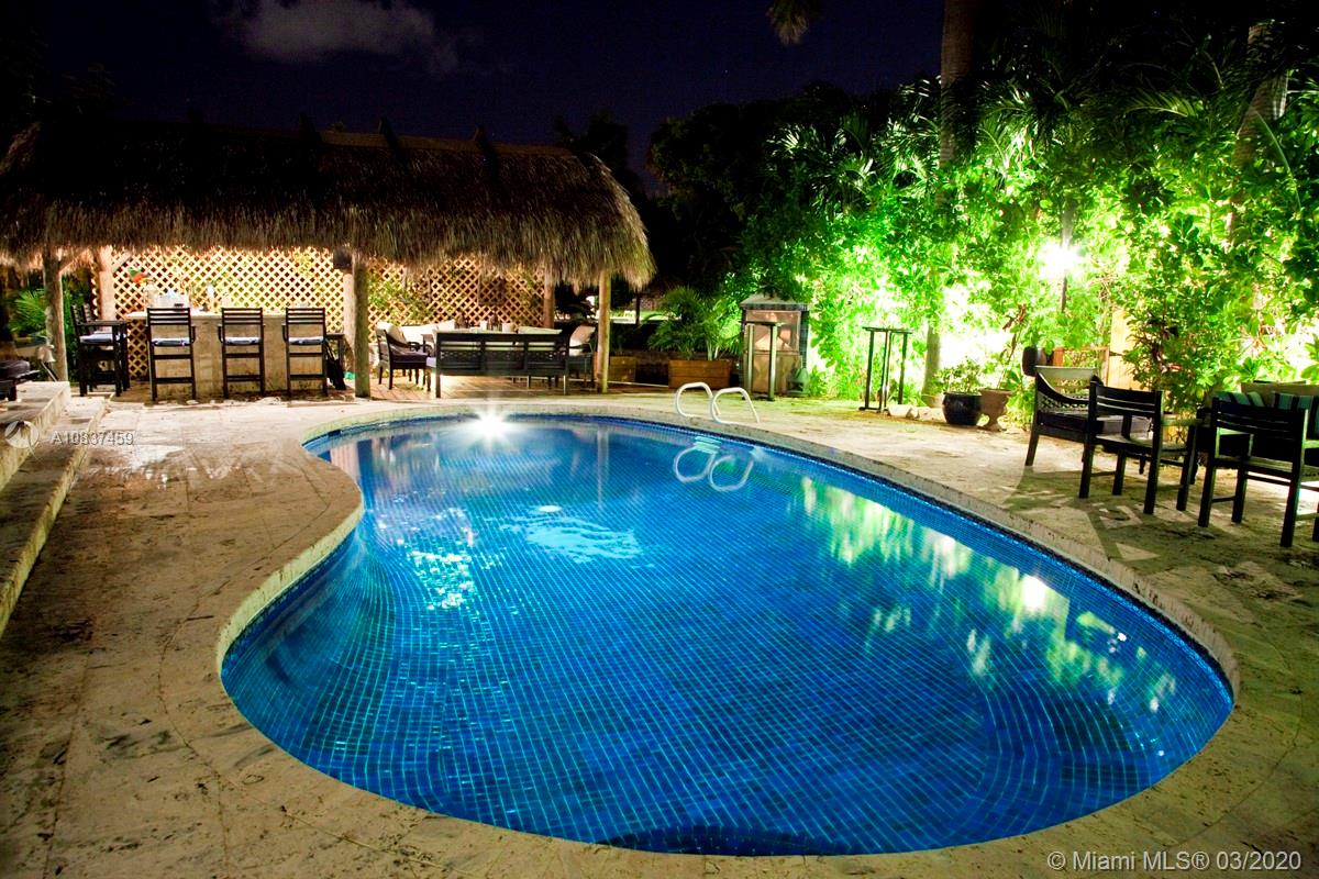 7975 Biscayne Point Circle Miami Beach, FL 33141 - Photo 30 of 34 a view of a swimming pool with an outdoor seating
