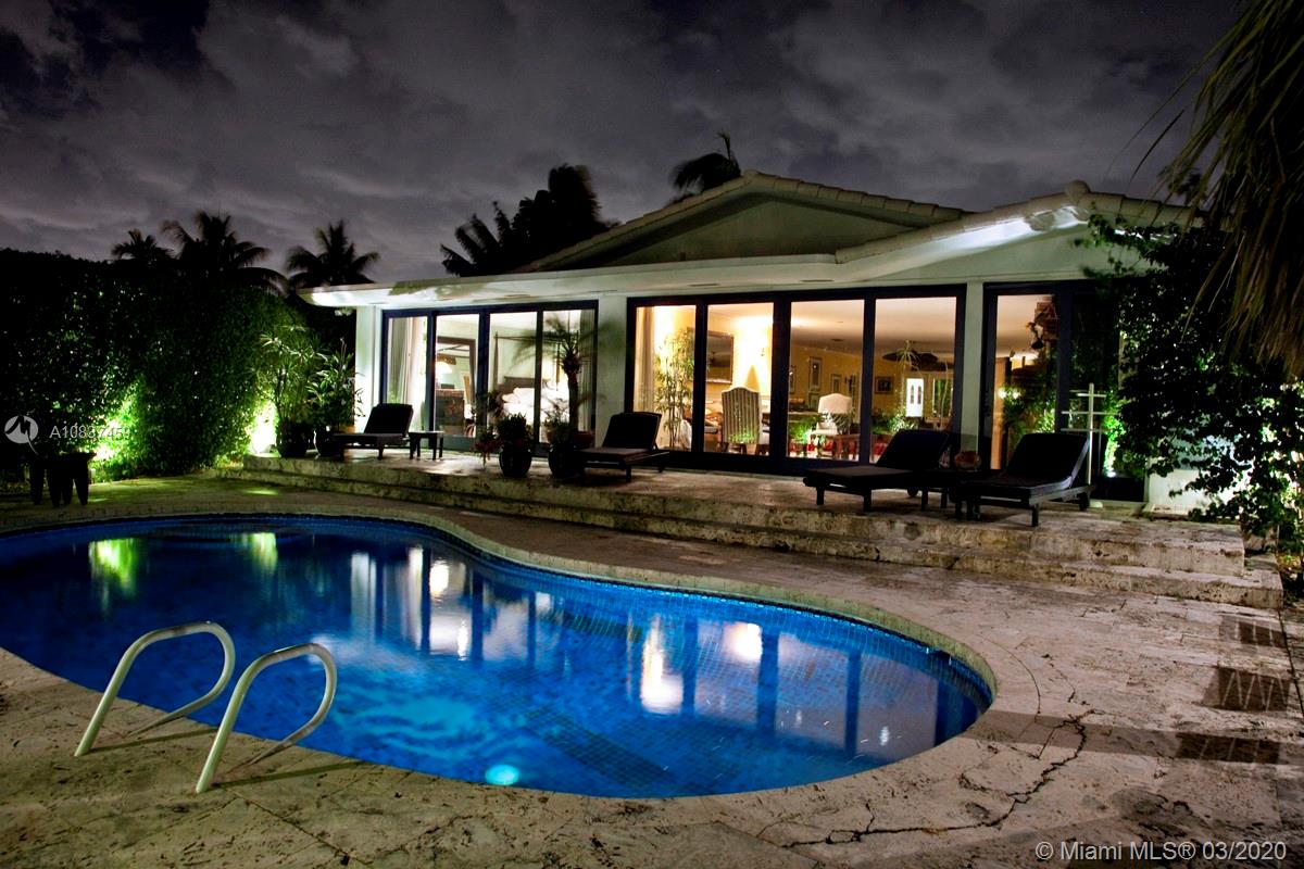 7975 Biscayne Point Circle Miami Beach, FL 33141 - Photo 31 of 34 a view of a swimming pool with outdoor seating