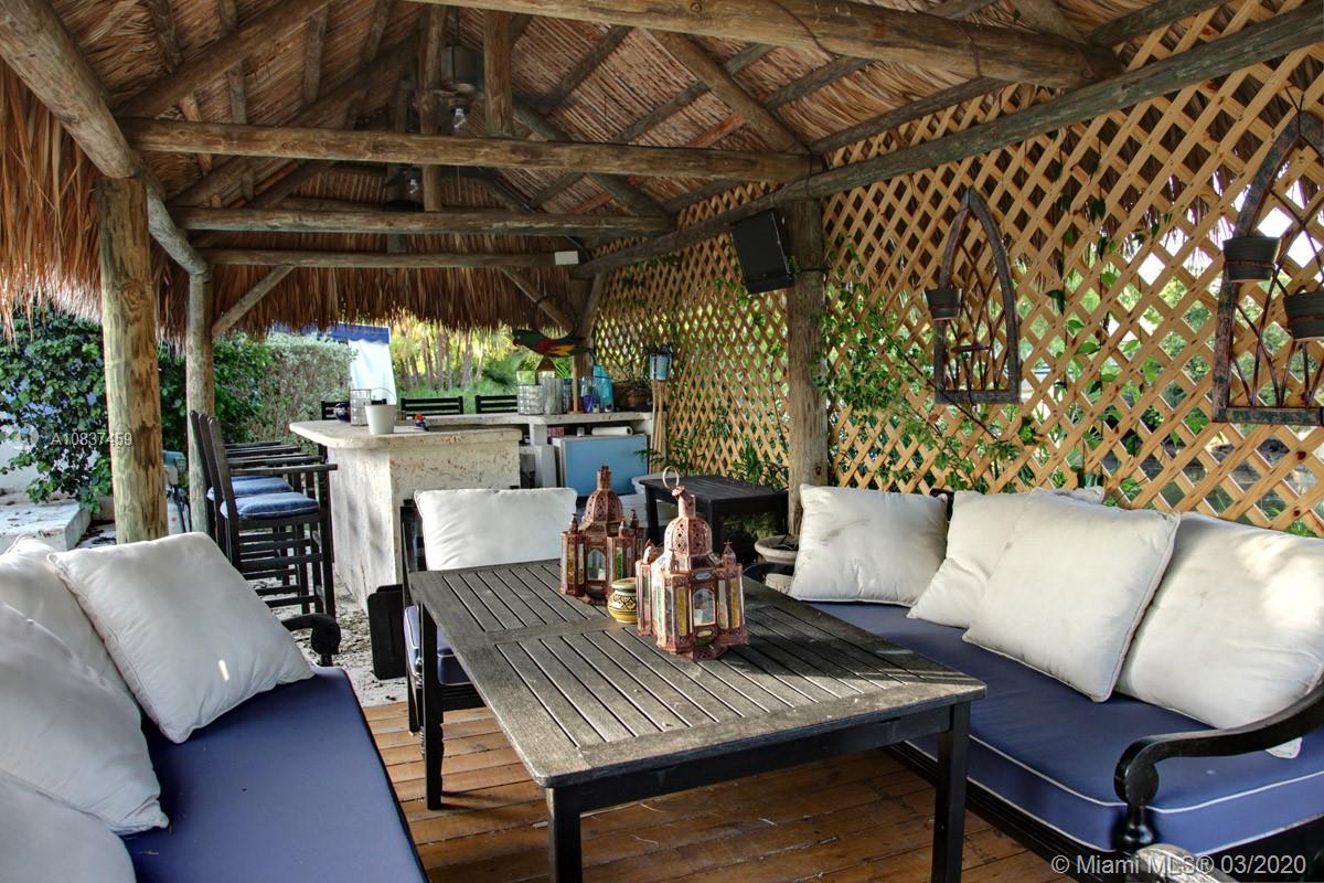 7975 Biscayne Point Circle Miami Beach, FL 33141 - Photo 10 of 34 a view of a dining room with furniture window and outside view