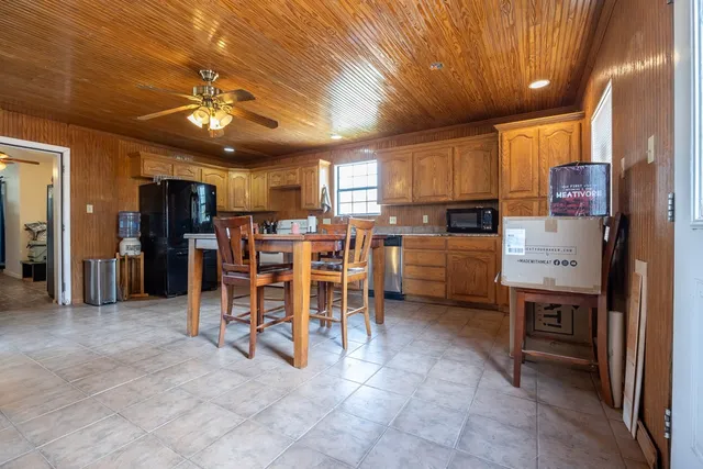 a kitchen with stainless steel appliances granite countertop a sink and a stove