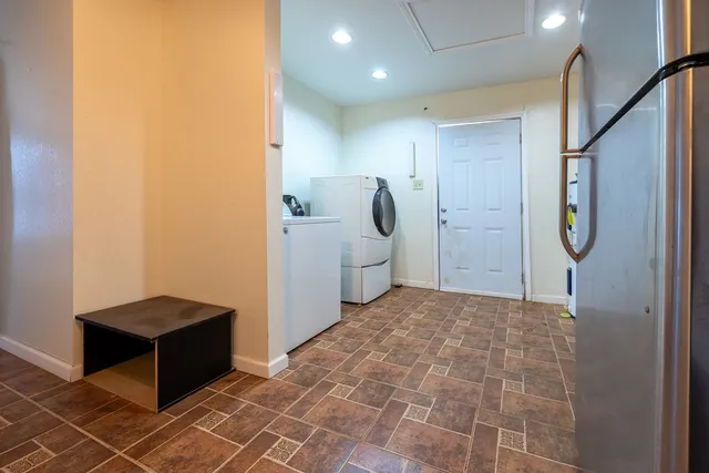 a bathroom with a glass door shower and a sink