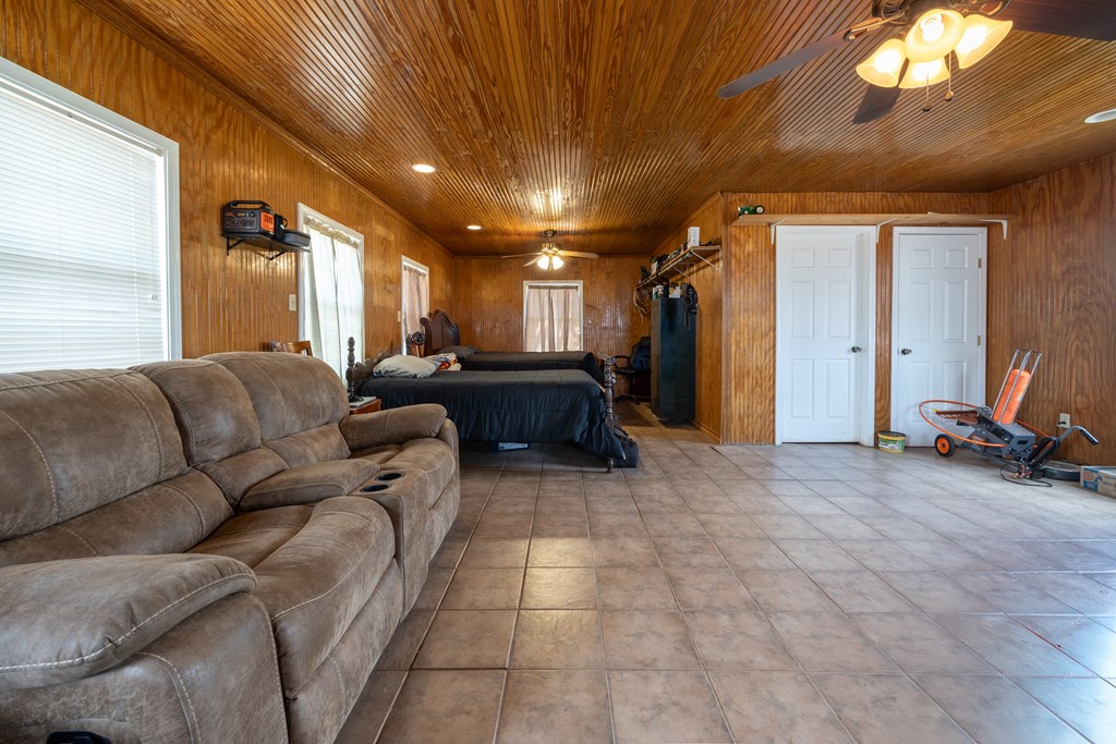 1596 Mule Creek Road Robert Lee, TX 76945 - Photo 20 of 98 a living room with furniture a large window and a chandelier