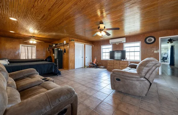 an aerial view of houses covered in trees