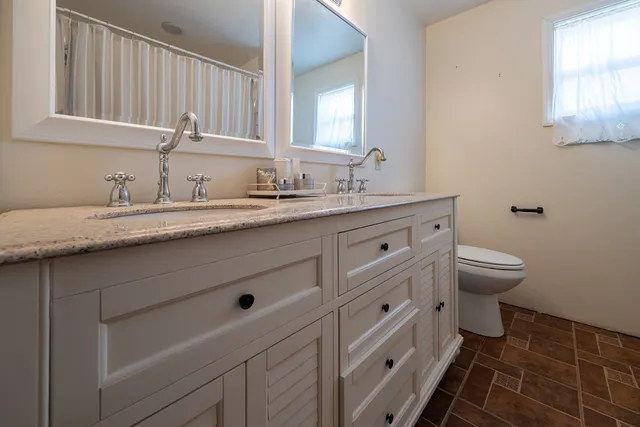 a view of a large body of water with a building in the background