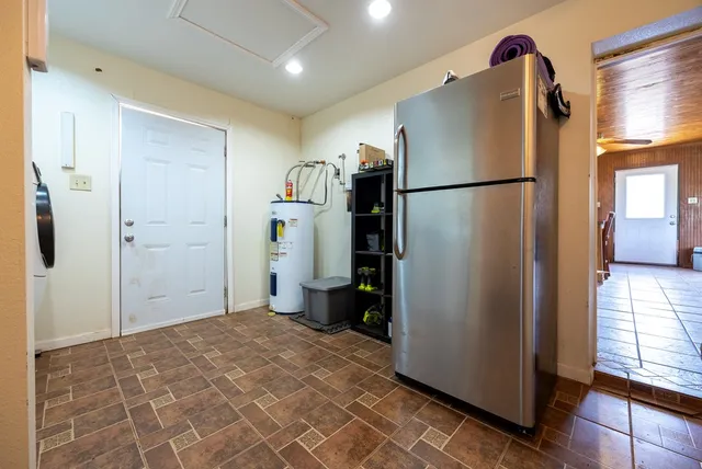 a view of a green field with lots of trees