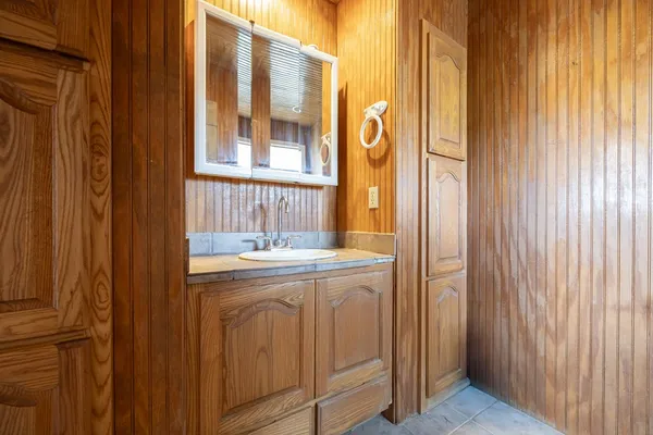 a view of a lush green forest with trees and some houses