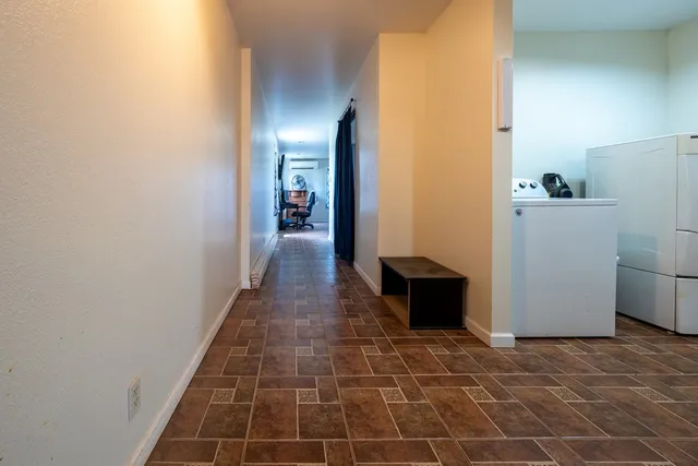 a bathroom with a toilet and a shower curtain