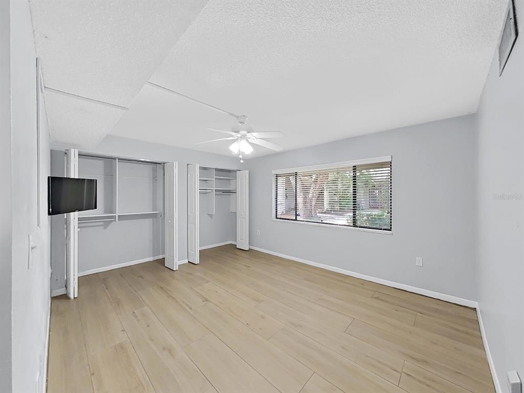 700 Starkey Road, Unit 511 Largo, FL 33771 - Photo 17 of 27 wooden floor in an empty room with a window