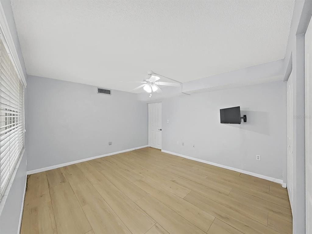 700 Starkey Road, Unit 511 Largo, FL 33771 - Photo 18 of 27 wooden floor in an empty room