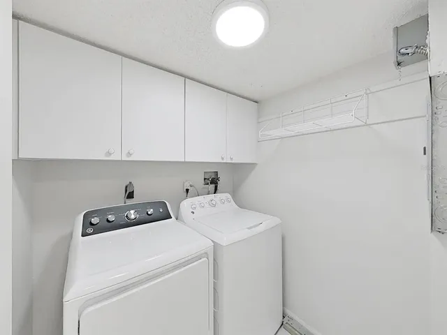 a view of storage and utility room with washer and dryer