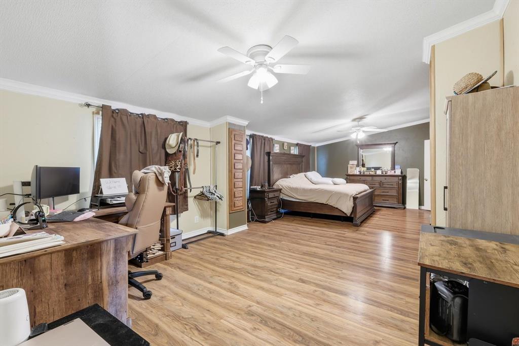 1200 Alliance Boulevard Rhome, TX 76078 - Photo 20 of 31 Bedroom with ornamental molding, an office area, light wood-style floors, and ceiling fan
