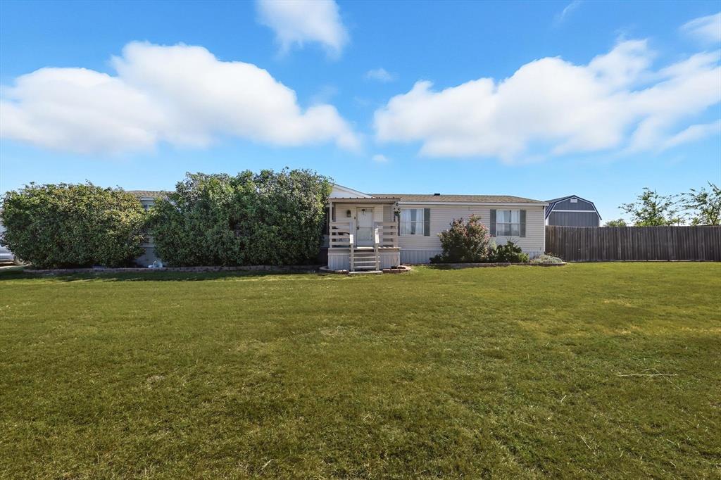 1200 Alliance Boulevard Rhome, TX 76078 - Photo 4 of 31 Rear view of property featuring a wooden deck