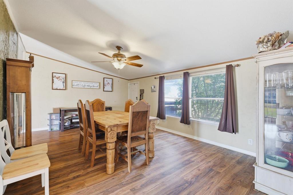 1200 Alliance Boulevard Rhome, TX 76078 - Photo 10 of 31 Dining area with wood finished floors, crown molding, vaulted ceiling, and ceiling fan