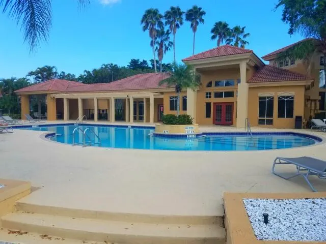 swimming pool view with a outdoor seating