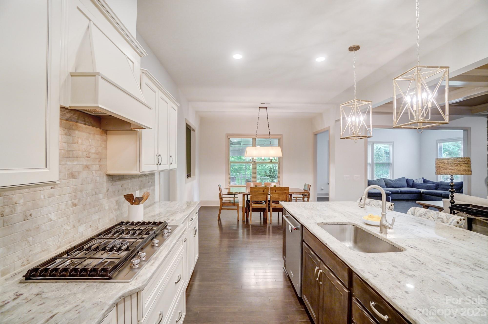 6030 Fallondale Road Waxhaw, NC 28173 - Photo 12 of 48 a kitchen with stainless steel appliances granite countertop a sink stove and cabinets