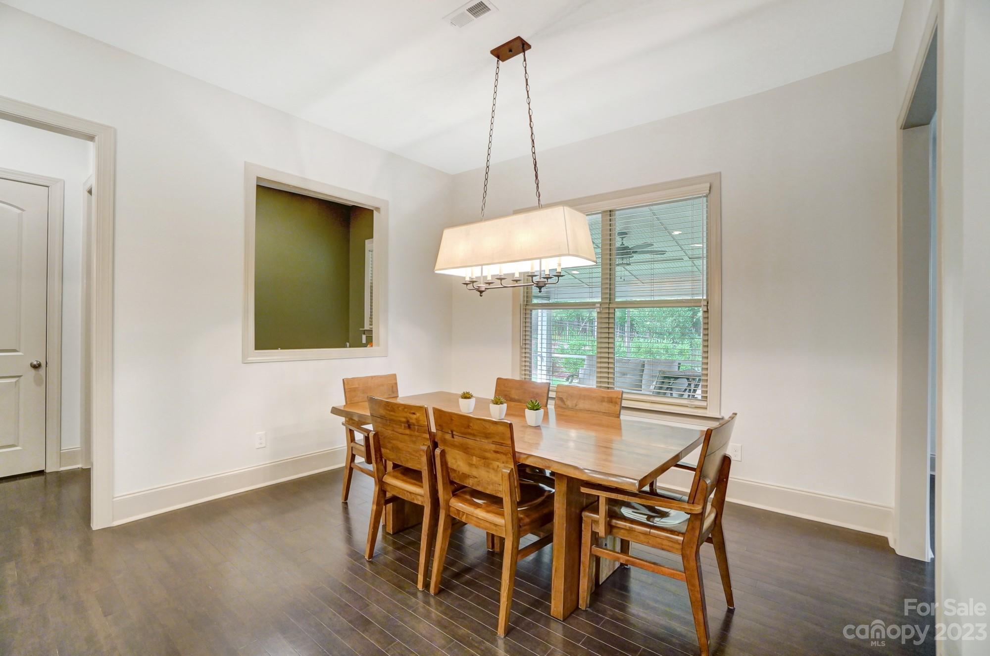 6030 Fallondale Road Waxhaw, NC 28173 - Photo 13 of 48 a view of a dining room with furniture window and wooden floor