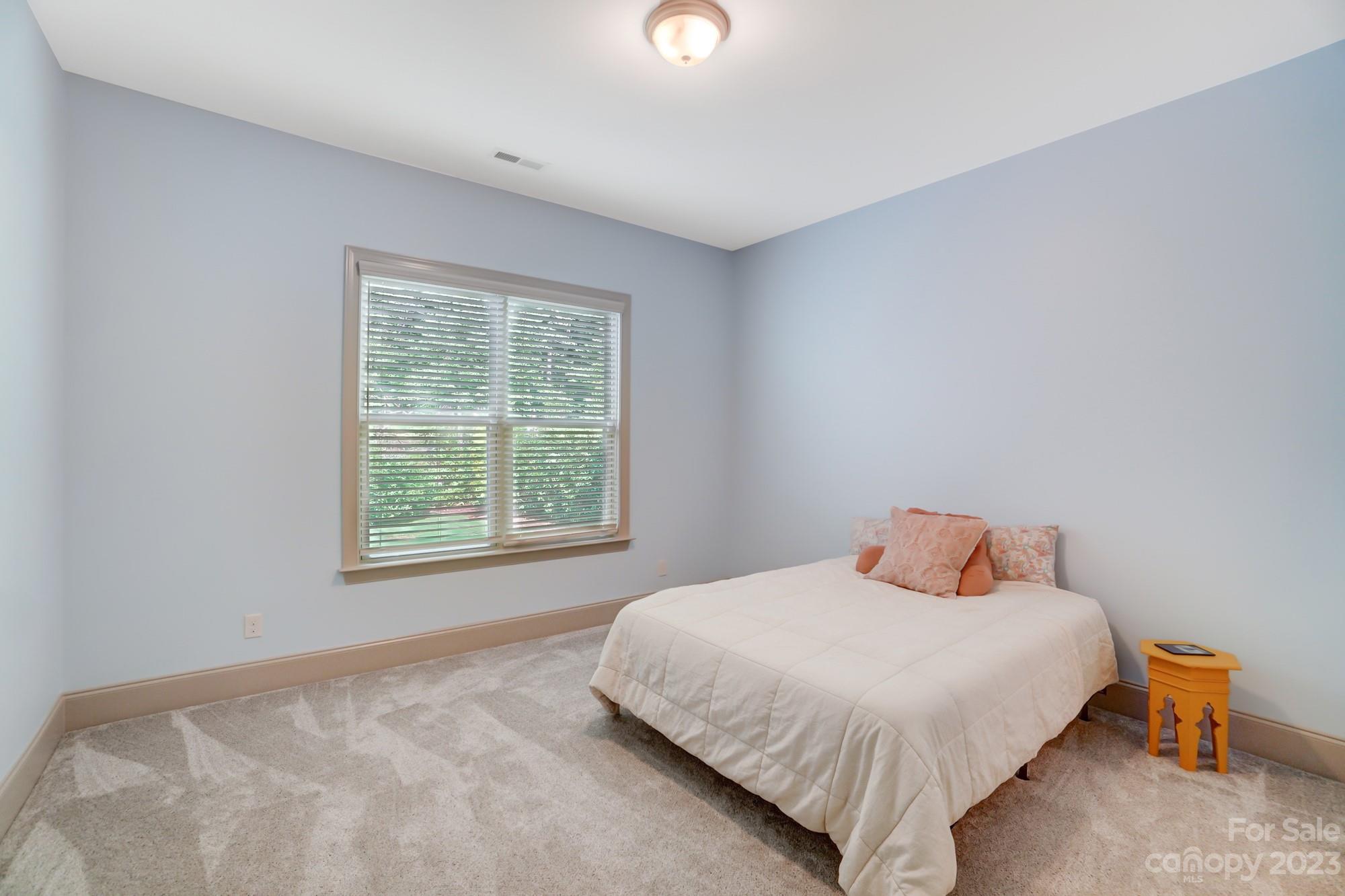 6030 Fallondale Road Waxhaw, NC 28173 - Photo 19 of 48 a bedroom with a bed and window