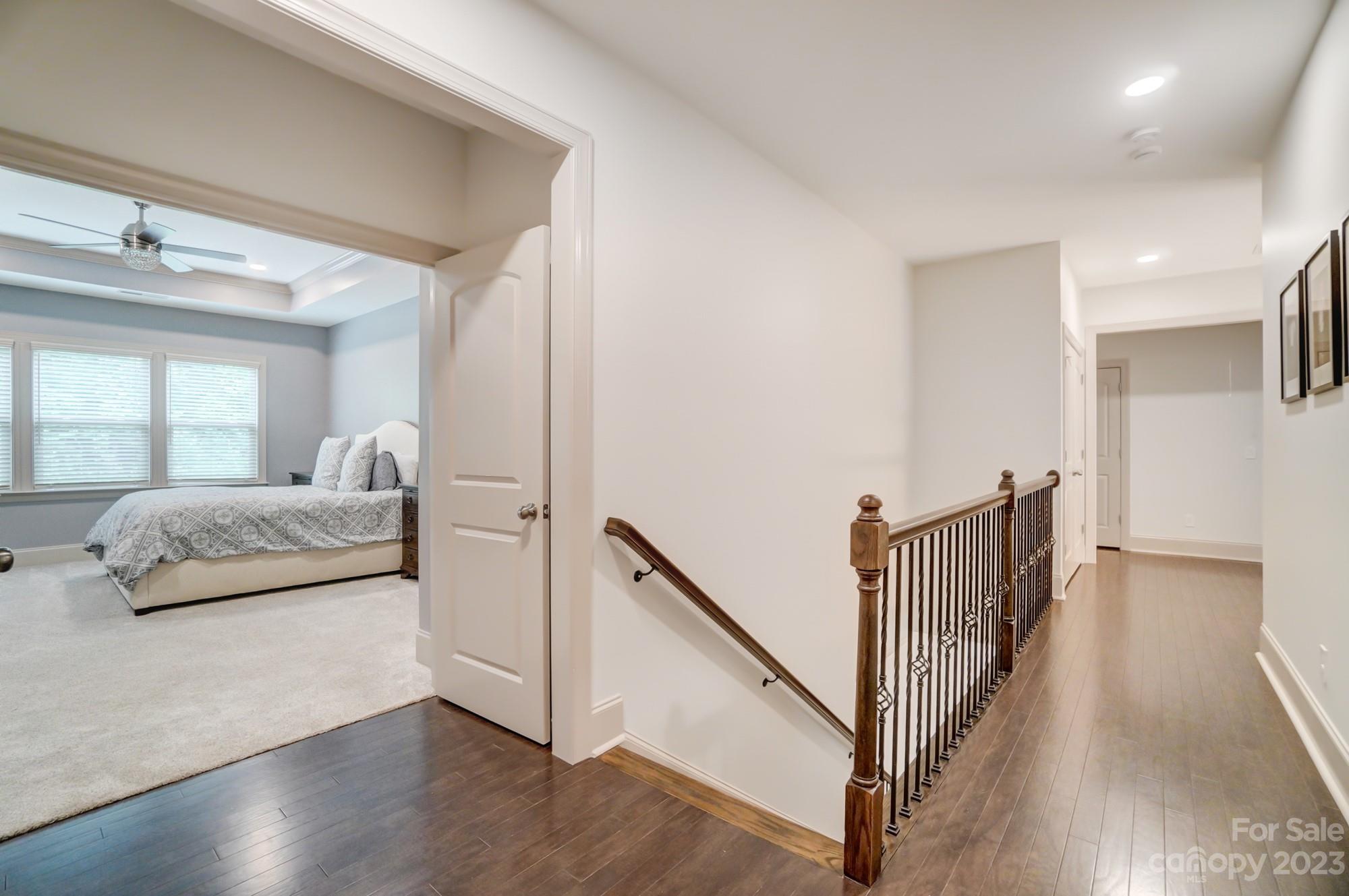 6030 Fallondale Road Waxhaw, NC 28173 - Photo 20 of 48 a bedroom with wooden floor and a large window