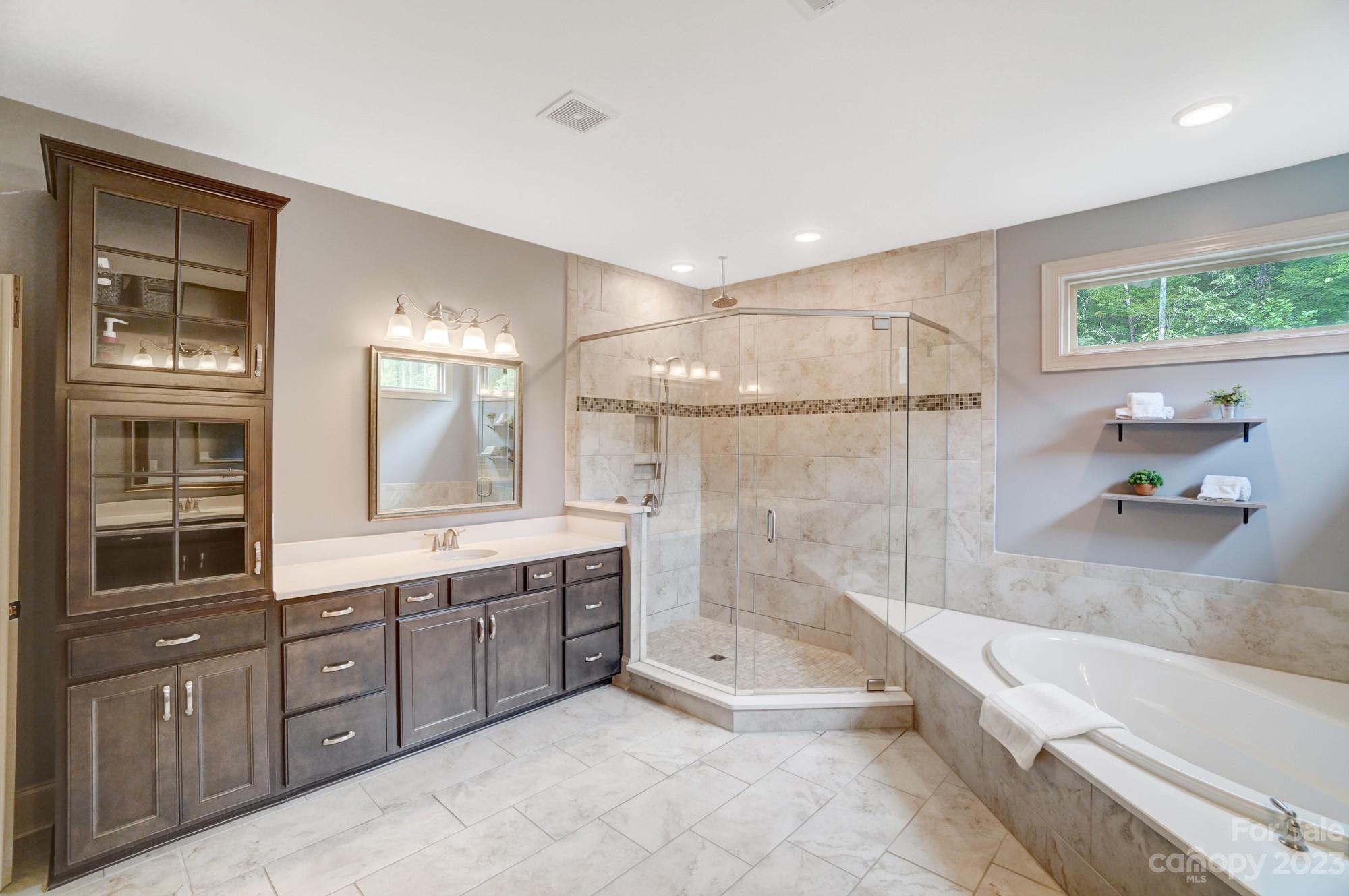 6030 Fallondale Road Waxhaw, NC 28173 - Photo 25 of 48 a large spacious bathroom with a tub shower and sink