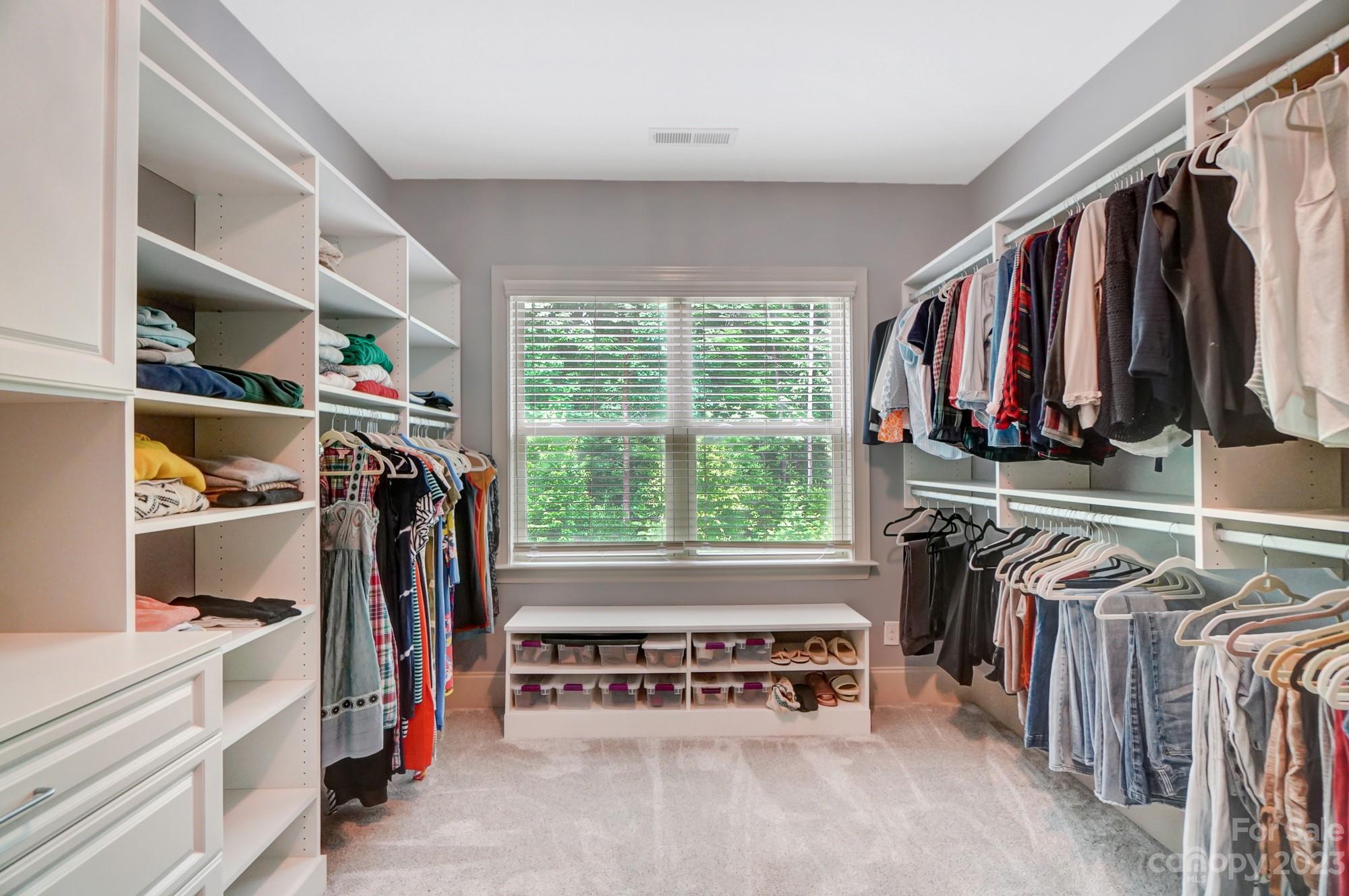 6030 Fallondale Road Waxhaw, NC 28173 - Photo 28 of 48 a view of walk in closet with clothes and shoes