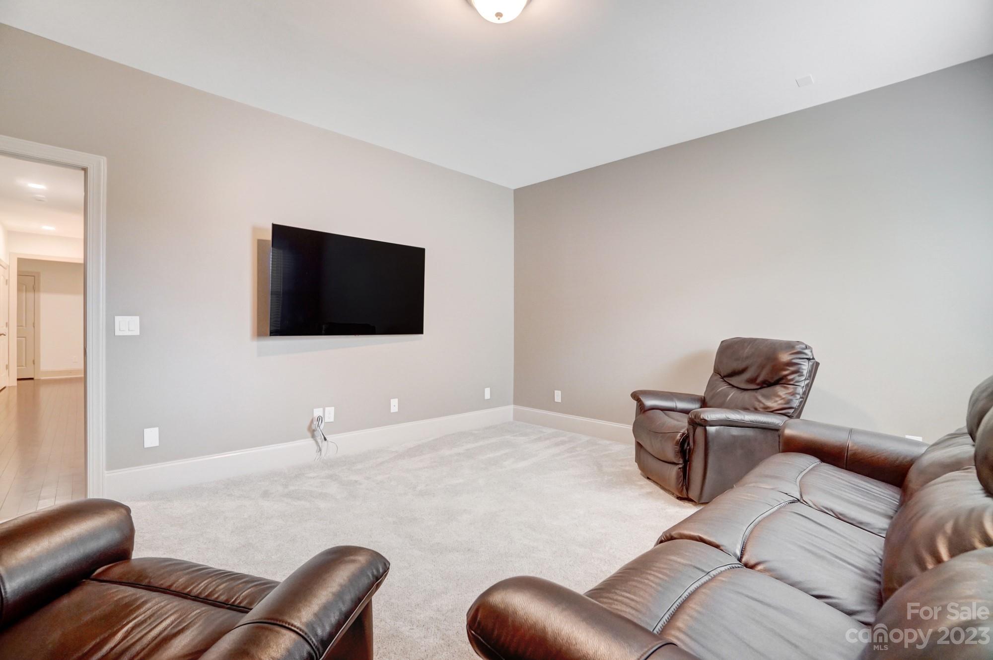 6030 Fallondale Road Waxhaw, NC 28173 - Photo 39 of 48 a living room with furniture and a flat screen tv