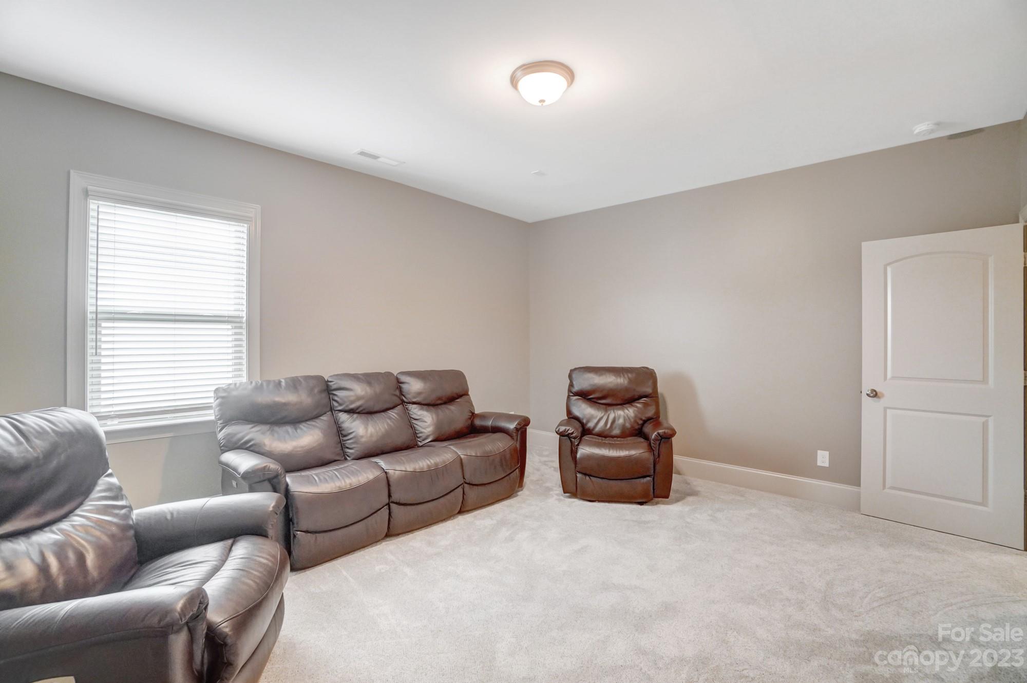 6030 Fallondale Road Waxhaw, NC 28173 - Photo 40 of 48 a living room with furniture and a window