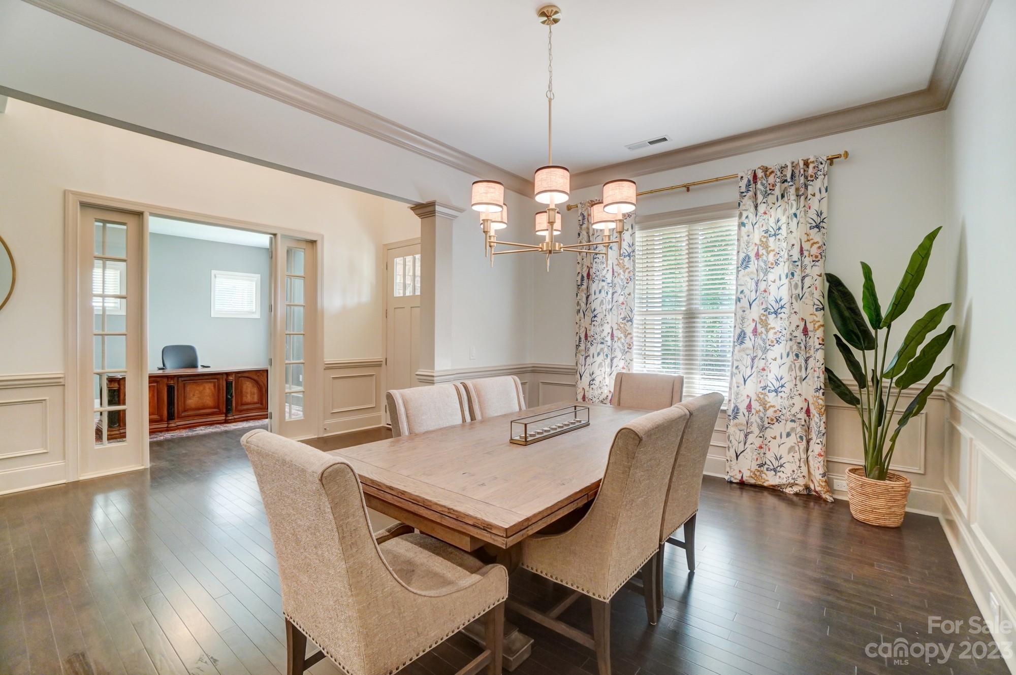6030 Fallondale Road Waxhaw, NC 28173 - Photo 4 of 48 a view of a dining room with furniture wooden floor and chandelier