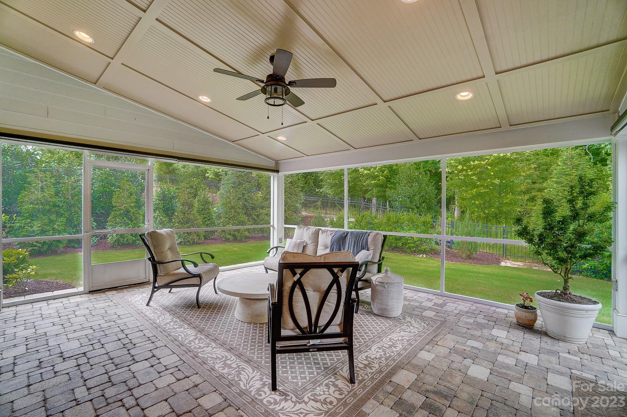 6030 Fallondale Road Waxhaw, NC 28173 - Photo 43 of 48 a view of a patio with a dining table and chairs