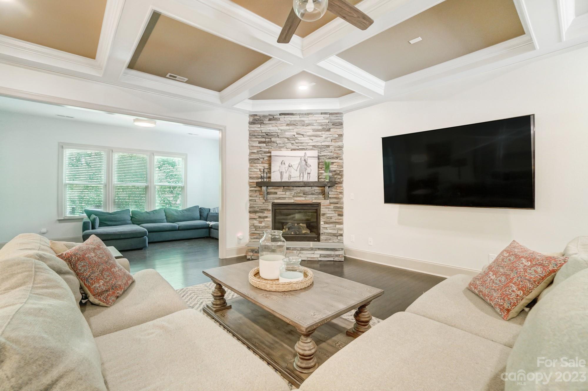 6030 Fallondale Road Waxhaw, NC 28173 - Photo 7 of 48 a living room with furniture a flat screen tv and a large window