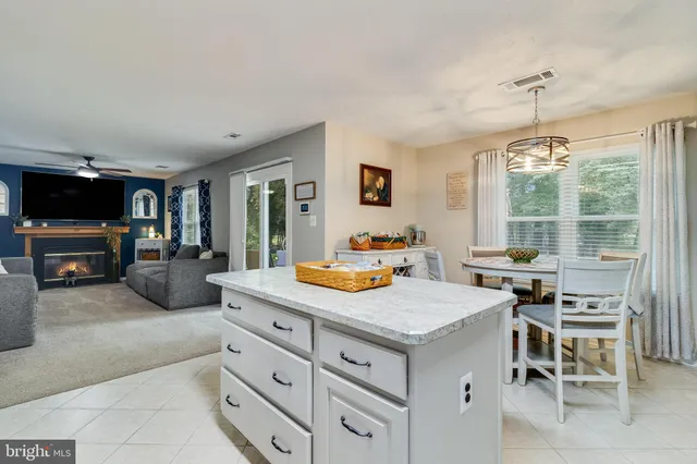 a kitchen with granite countertop a sink and a stove