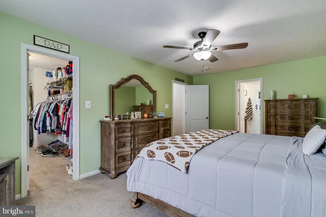 a bedroom with a bed and a walk in closet