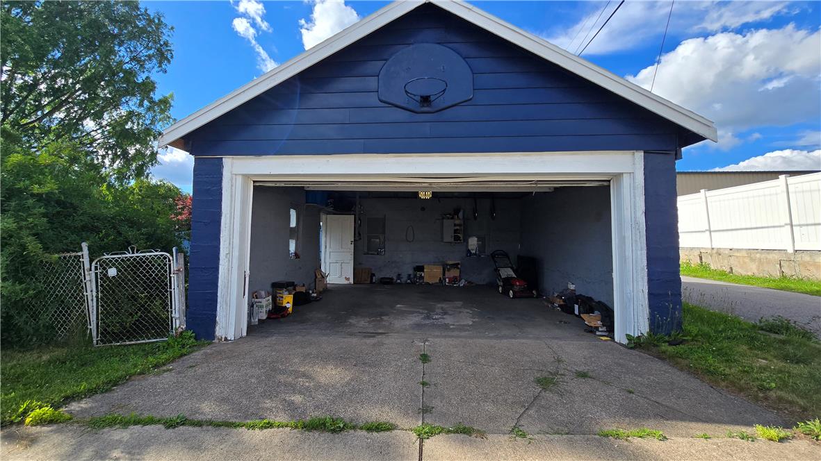 883 North Locust Street Hazleton, PA 18201 - Photo 35 of 83 A detached garage features a basketball hoop and ample space for storage or parking.