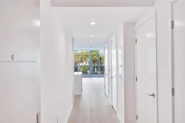 a kitchen with stainless steel appliances a refrigerator and a stove top oven