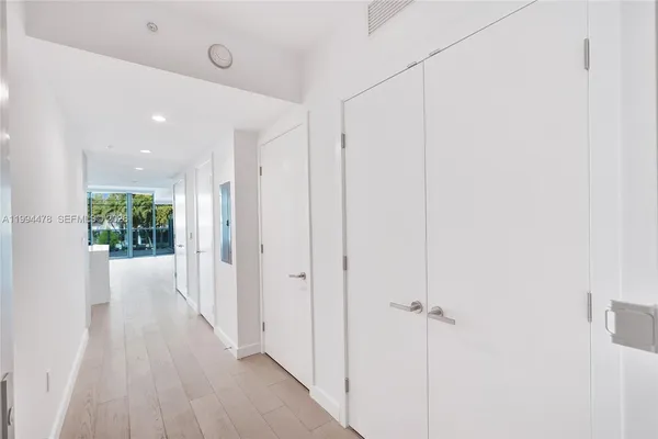a kitchen with a sink and large cabinets