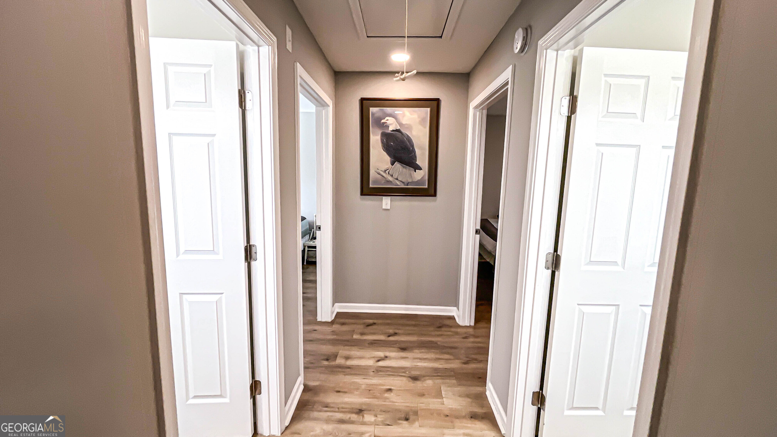 587 Highway 41 Milner, GA 30257 - Photo 116 of 172 a view of a hallway with wooden floor and windows