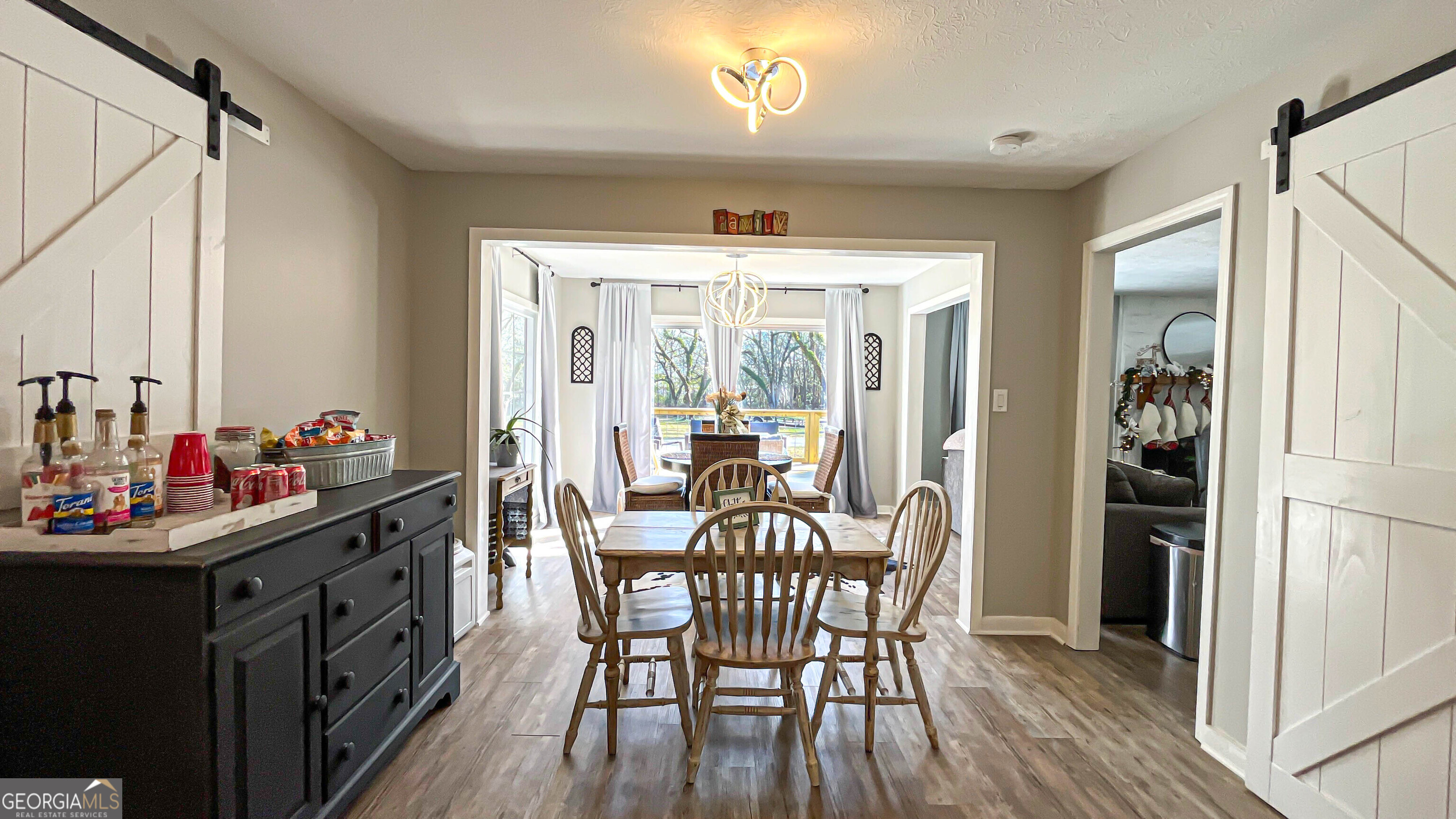 587 Highway 41 Milner, GA 30257 - Photo 39 of 172 a view of a dining room with furniture and chandelier